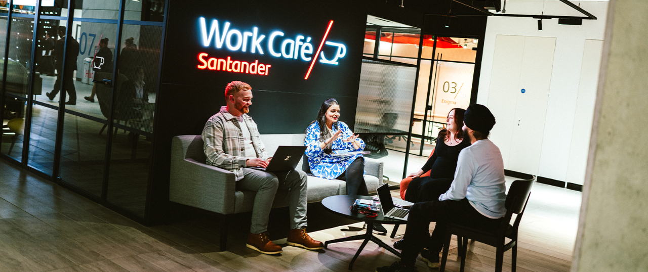 Work Cafe customers sitting down together.